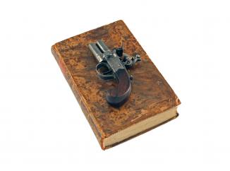 A Flintlock Pistol in a Book.