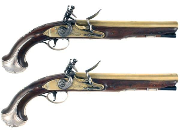 A Pair of Silver Mounted Flintlock Pistols
