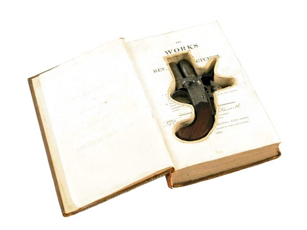A Flintlock Pistol in a Book.