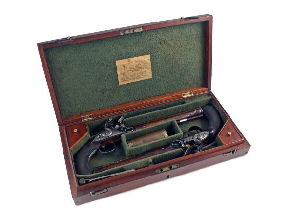 A Cased Pair of Flintlock Duelling Pistols by Wilson of London.