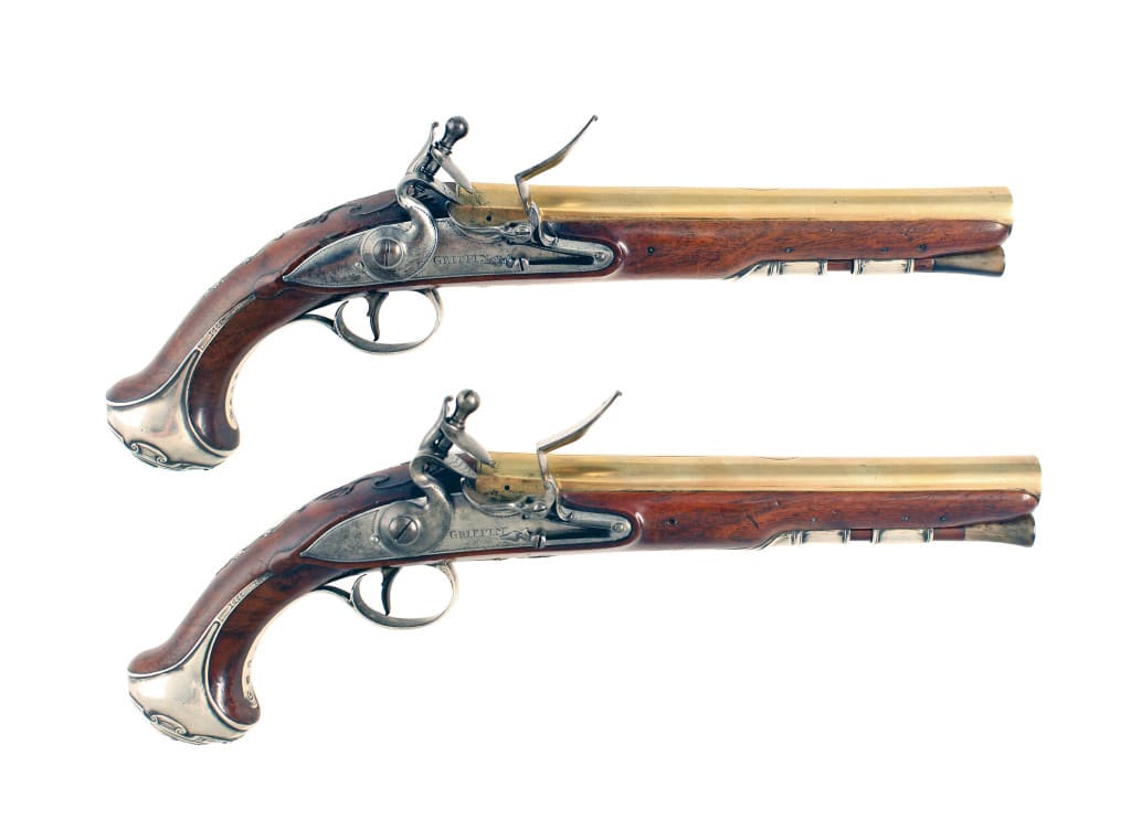 A Superb Pair of Silver Mounted Flintlock Holster Pistols by Griffin.