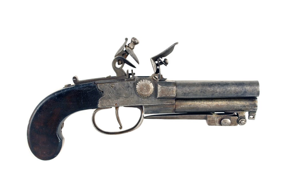 A Rare 80 Bore Three-Barrelled Tap Action Pistol.