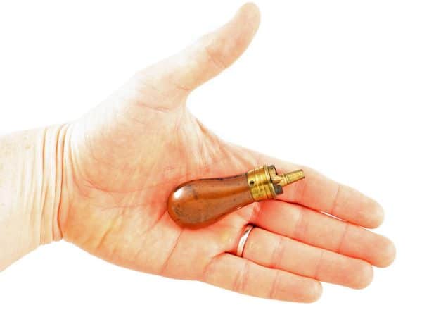 A Tiny Pistol Powder Flask.