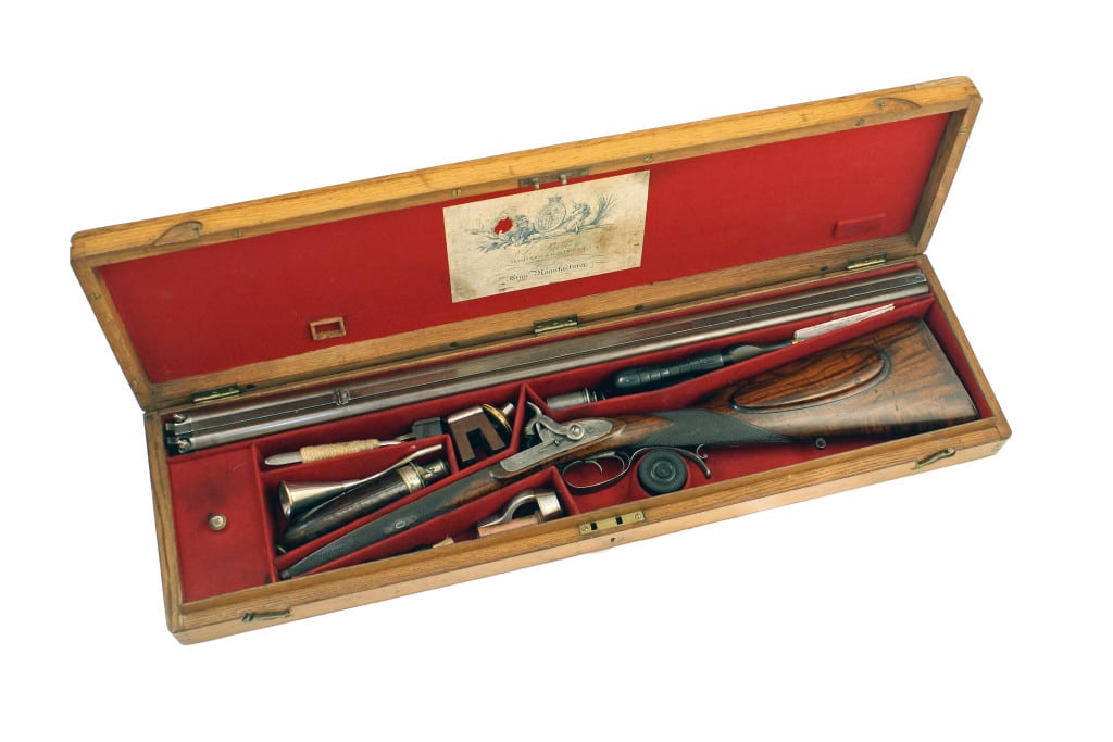 A Cased Percussion Purdey Rifle, No. 7018.