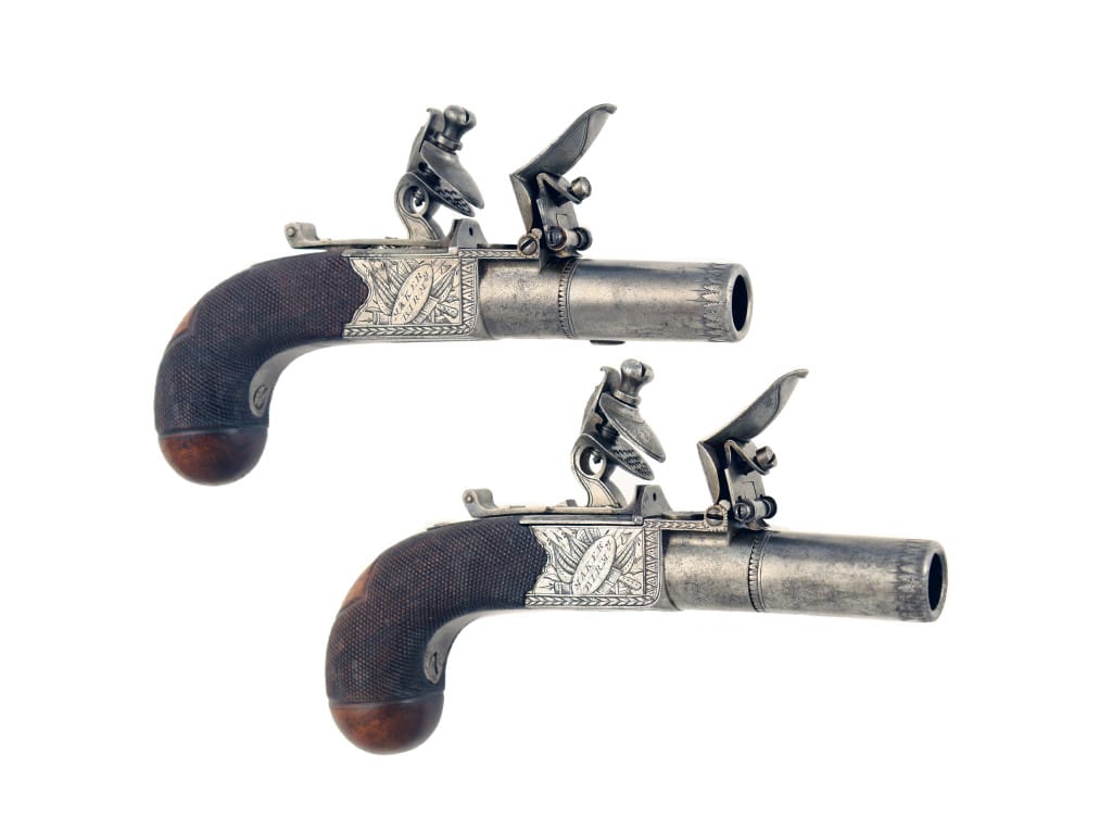 A Good Pair of Round Framed Pocket Pistols