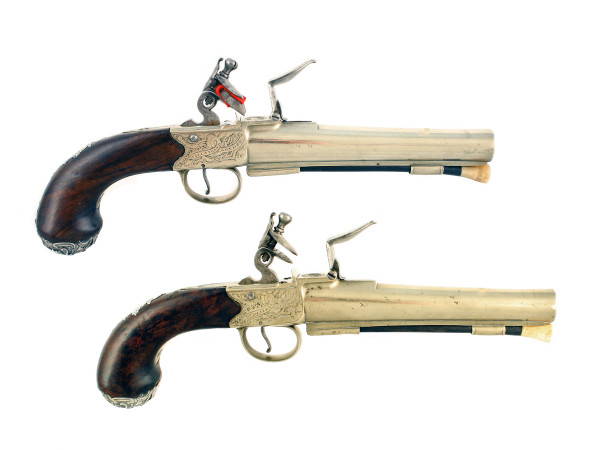 A Large Pair of Tutaneg Silver Mounted Officers Pistols.