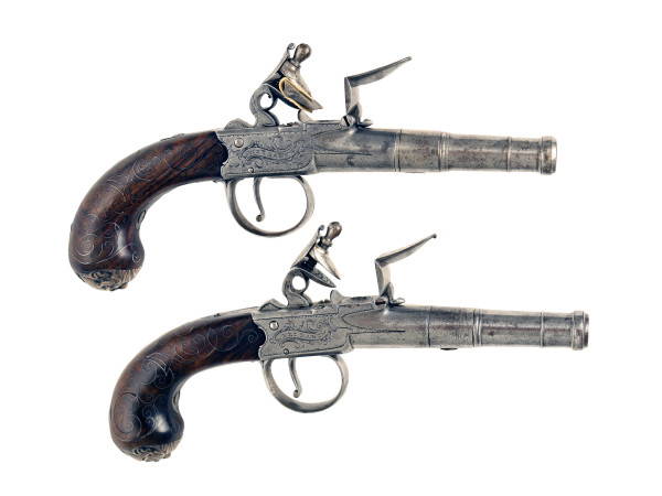 A Pair of Silver Inlaid Cannon Barrelled Pistols